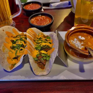 Diabla tacos, side of beans and a pitcher of Pacifico