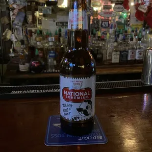a bottle of beer on a coaster