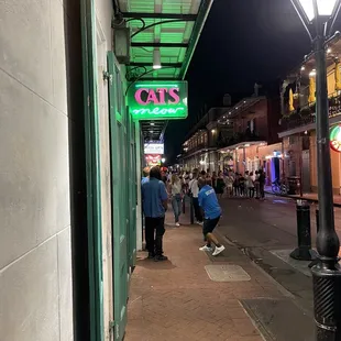 people walking down the sidewalk