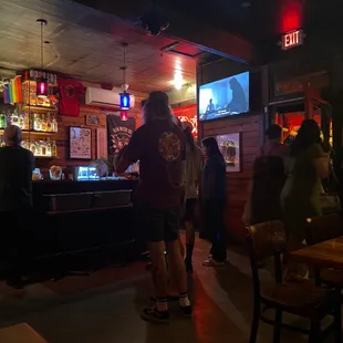 a group of people at a bar