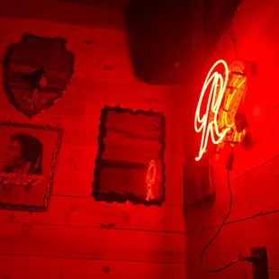 a neon sign in a dimly lit room
