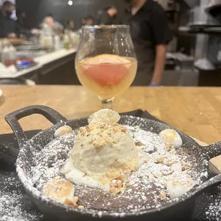 Brownie Skillet with Ice Cream and Roasted Meringue  Smoked Paloma cocktail