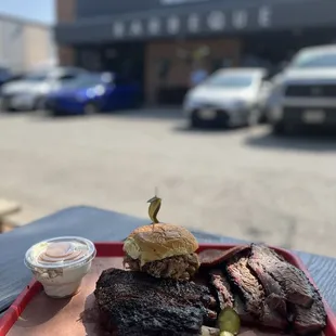a plate of steak and pickles