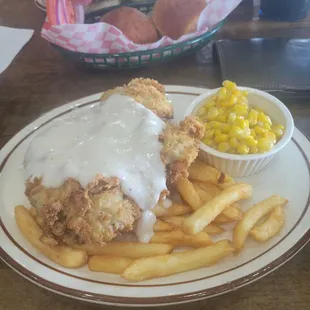Fried Chicken Steak dinner w corn and fries.