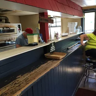 A long counter with barstool seats - not any real dining area