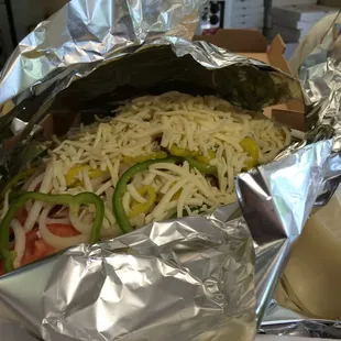 This is the HUGE antipasto salad, overflowing in a large pizza box