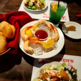 a plate of shrimp and a salad