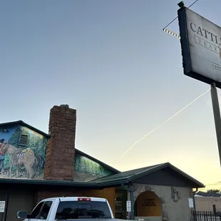 a truck parked in front of the restaurant