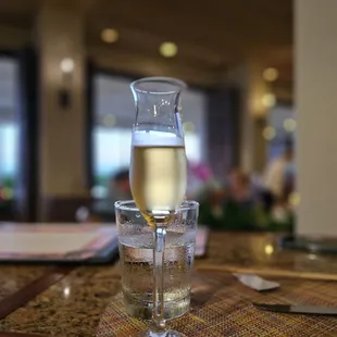 a glass of wine and a pitcher