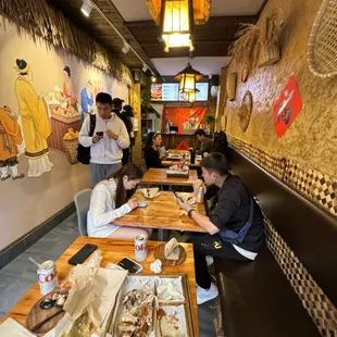 a group of people eating in a restaurant