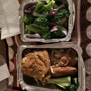 two containers of food on a table