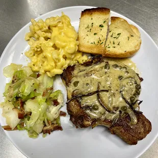 Seared Pork Chop, Dijon Lemon Butter Sauce, Sautéed Cabbage w/Bacon, Mac &amp; Cheese, Garlic Bread