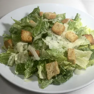Caesar Salad: romaine, hand shaved parmesan, croutons with house made caesar dressing