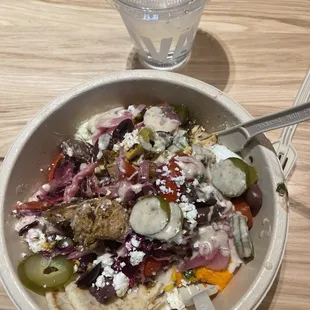 a bowl of food and a glass of water