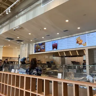 Only one person on the line and one person at the cashier with a line to the door.