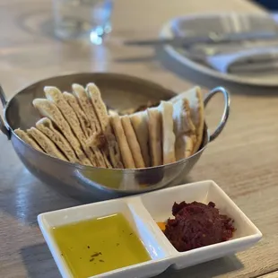 pita bread, spicy tomato spread, Italian butter while we wait