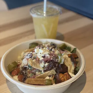 a bowl of food and a drink