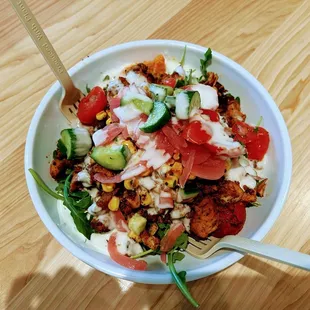 a bowl of food on a wooden table