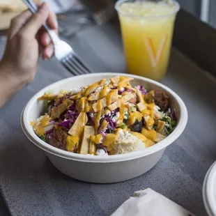 a person eating a bowl of food