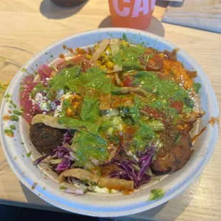 Greens and Grain, 1/2 Falafel 1/2 Honey Chicken, Skhug and Harissa vinaigrette