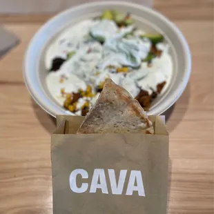 a plate of food and a bowl of yogurt