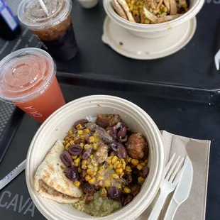 two bowls of food on a tray