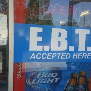 an ebtt accepted here sign in a store window