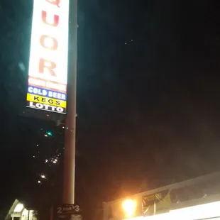 a neon sign for a liquor store