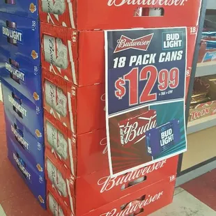 a stack of budweiser bottles