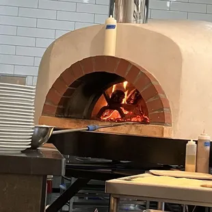 Front row seat to the pizza oven. Need to try their pizza next time