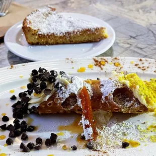 cannoli in front, coconut cake in the back