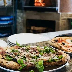 Arugula &amp; Prosciutto Pizza - house made mozzarella, arugula, prosciutto di Parma,
 balsamic glaze, shaved parmigiano