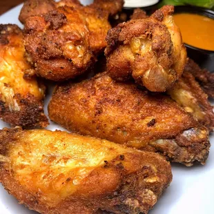 a plate of fried chicken wings