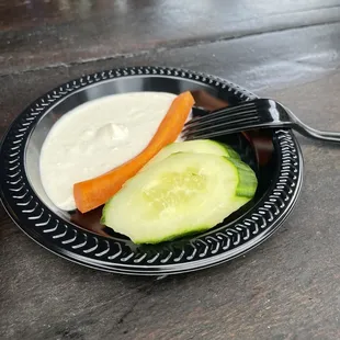 a cucumber and carrot on a plate