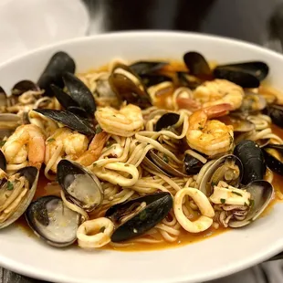 a bowl of seafood and pasta