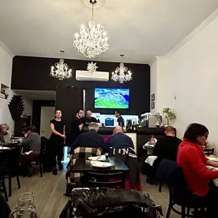 a group of people sitting in a restaurant