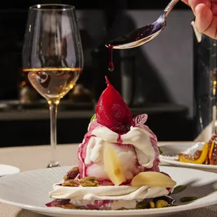 a dessert being drizzled with a spoon
