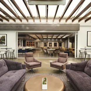 a modern living room with wood beams