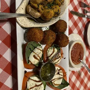 Sorry this is sideways. Top to bottom: crab mushrooms, risotto balls (arancini), and caprese