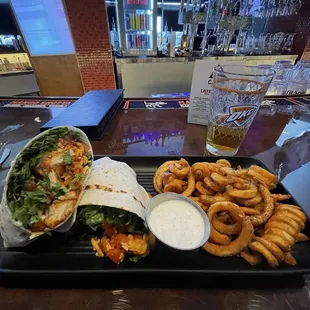 Grilled chicken wrap with curly fries