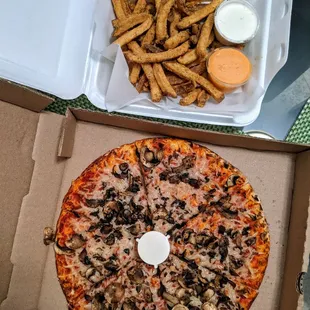 Small mushroom pizza with non-dairy cheese and Caveman fries