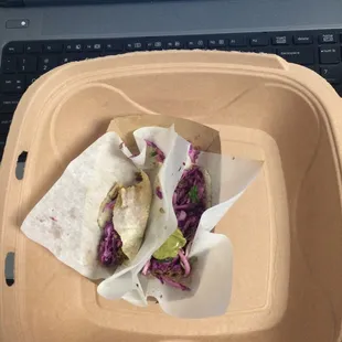 tiny tiny jicama tacos. yummy but so tiny for $7. i'm so hungry and disappointed!