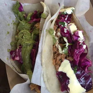 Tacos -- 2 for $7. One chicken Guacamole and one Chorizo Aioli.