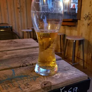 a glass of beer on a table