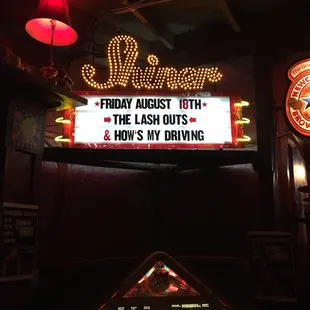 a sign that reads friday night with the las nights and how&apos;s my drinking