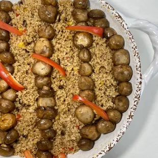 a plate of mushrooms and rice