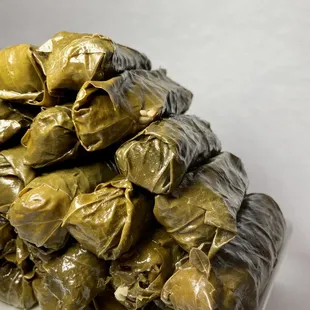 a plate of stuffed grape leaves