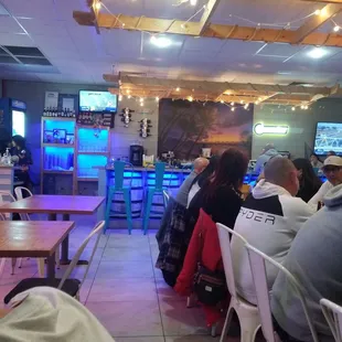 Part of the sitting area and bar.