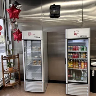 two refrigerators in a store