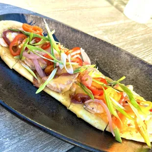 Pork flatbread with a substitution of salmon. The Kitchen graciously, accommodated our request. Absolutely delicious!